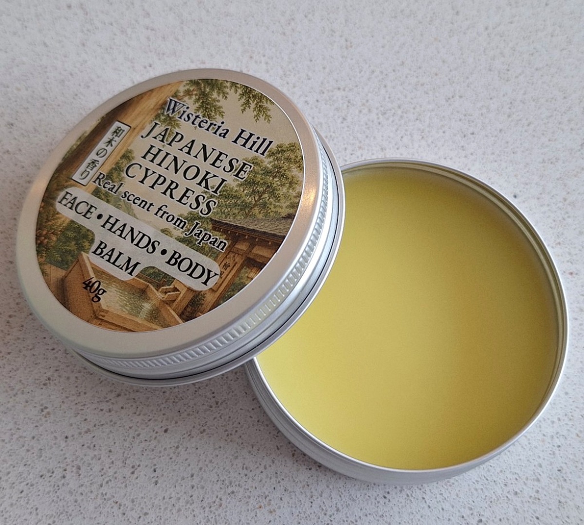 Open tin of Hinoki Cypress botanical balm