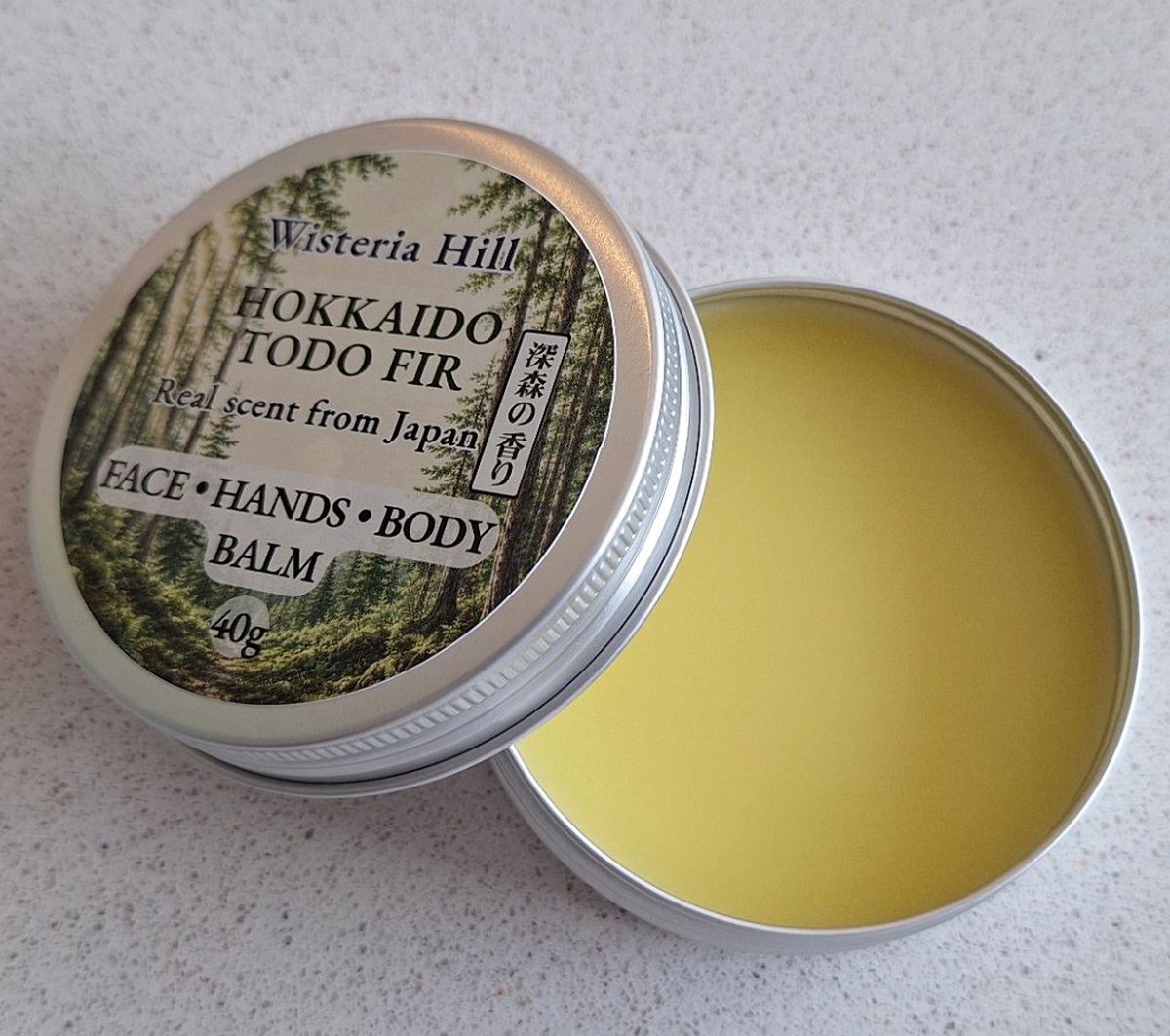Open tin of Todo Fir botanical balm