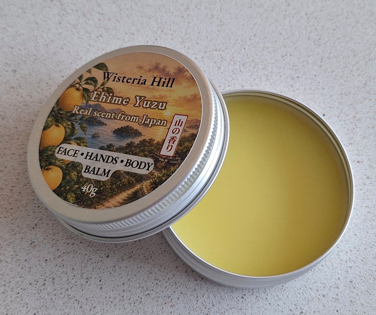 Open tin of Yuzu botanical balm